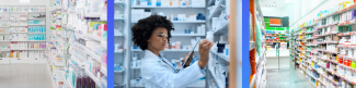 Pharmacy worker stocking shelves